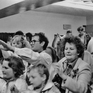 people watching teaser indoors