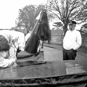 old oss hat being adjusted
