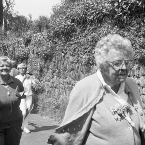 women walking in procession
