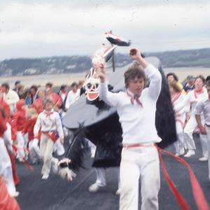 Old Oss Children's Oss, with bay in background