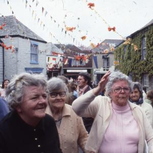 Three women under maypole