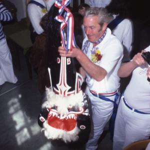 Blue Ribbon hat held up by man