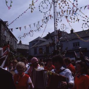 accordion players under maypole