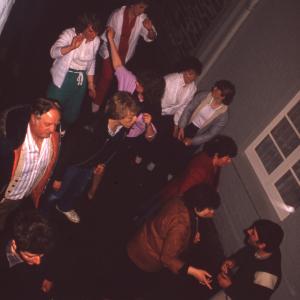 People in outside Harbour Inn at night