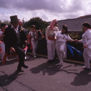 Master of Ceremonies dancing with women in procession