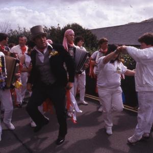 Master of Ceremonies dancing with women in procession