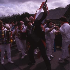 Master of Ceremonies dancing with women in procession