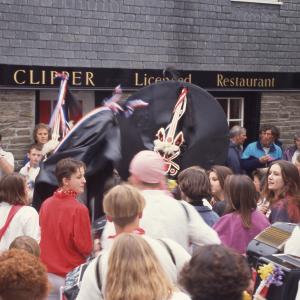 Blue Ribbon Oss and Old Oss dancing together at Mill Square