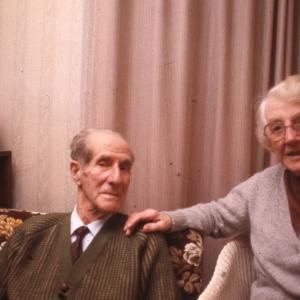 Man and woman with small christmas tree