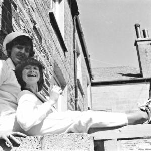 people sitting on wall