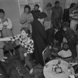 People in pub, woman singing and dancing