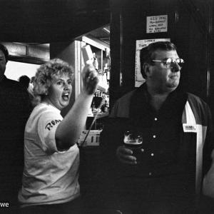 Woman with telephone in pub