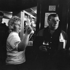 Woman with telephone in pub