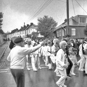 People dancing in road