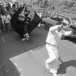 old oss being teased in procession