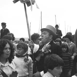 blue ribbon master of ceremonies in crowd