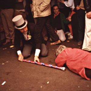 Master of Ceremonies kneeling on the floor