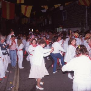 Old Oss party dancing on street at night
