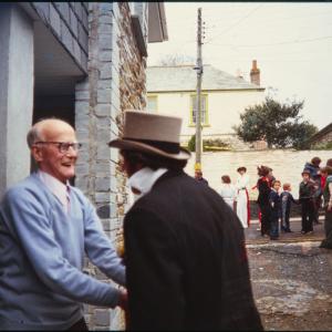 Master of Ceremonies shaking hands with man 