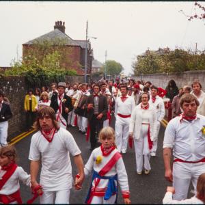 Old Oss party walking down street