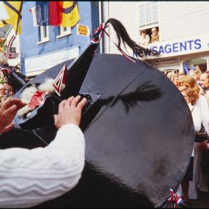 Blue Ribbon oss and crowd in town