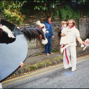 Old Oss and Teaser carrying child