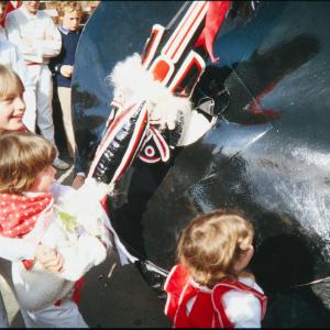 Old Oss being stroked by children