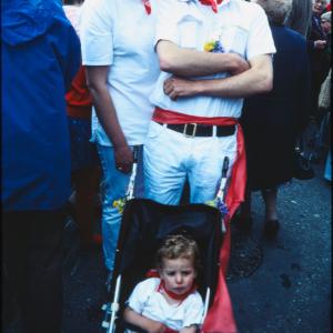 Man and woman with baby in pushchair