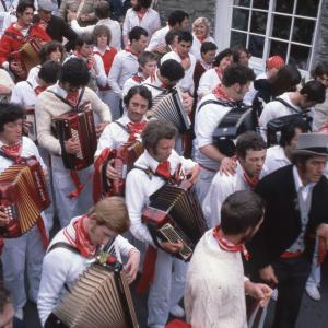 Old Oss procession walking along road