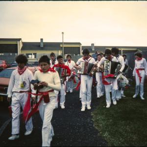 Early morning, Children's Oss band walking along road