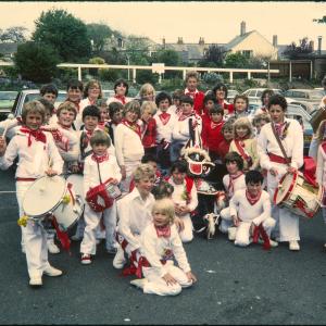 Children's Oss group posing for a photo with Old Oss