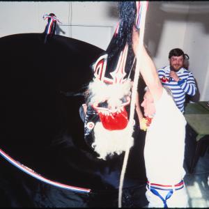 Blue Ribbon hat being placed on rider's head