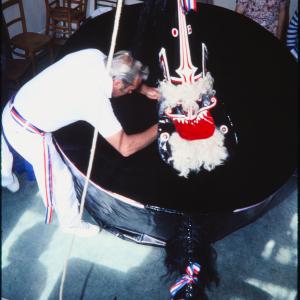 Blue Ribbon hat being placed on rider's head