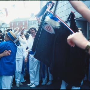 Blue Ribbon Oss dancing in crowded street