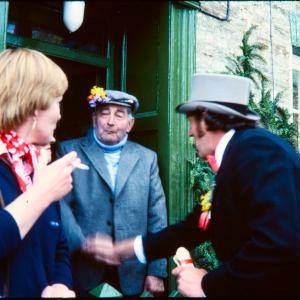 Master of Ceremonies greeting man in doorway