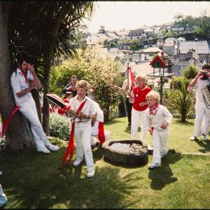 Children from Old Oss party walking through garden