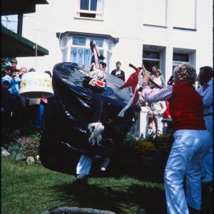 Old Oss being teased in garden of house