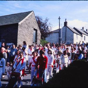 Old Oss procession walking down road