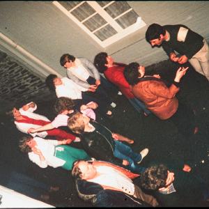 People in outside Harbour Inn at night