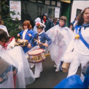 Children's Oss procession in the rain