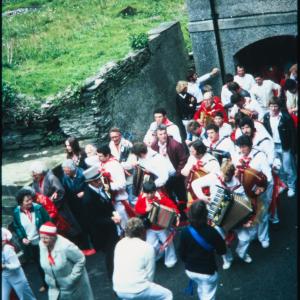 Old Oss band with master of ceremonies in alleyway