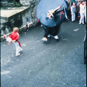 Old Oss being teased by child in alleyway