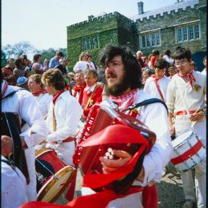 Man playing accordion outside Prideaux Place