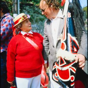 Man holding Old Oss hat with woman