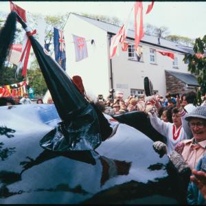 Old Oss oil-skin close up, with women holding onto edges