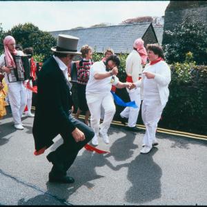Master of Ceremonies dancing with women in procession