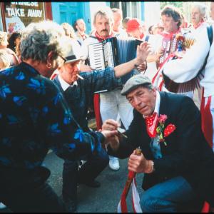 Old Oss Master of Ceremonies dancing with woman 