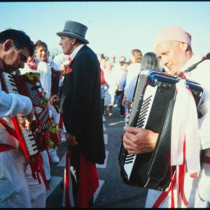 Old Oss accordion players and Master of Ceremonies on quay