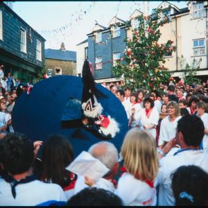 Blue Ribbon oss dancing under Maypole in evening
