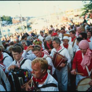 Old Oss musicians procession beside quay